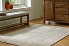 Gray area rug with subtle geometric pattern and short pile
