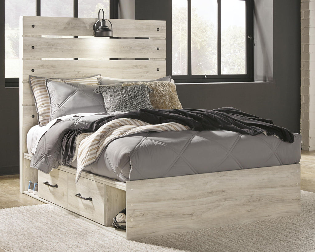 Beige panel bed with gray bedding and two front storage drawers, panel headboard