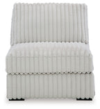 Light gray armless upholstered chair with high back and padded seat in channel quilting.