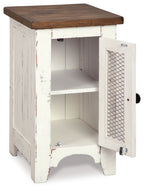 Chair side end table with open white door, interior shelves, brown top and mesh panel