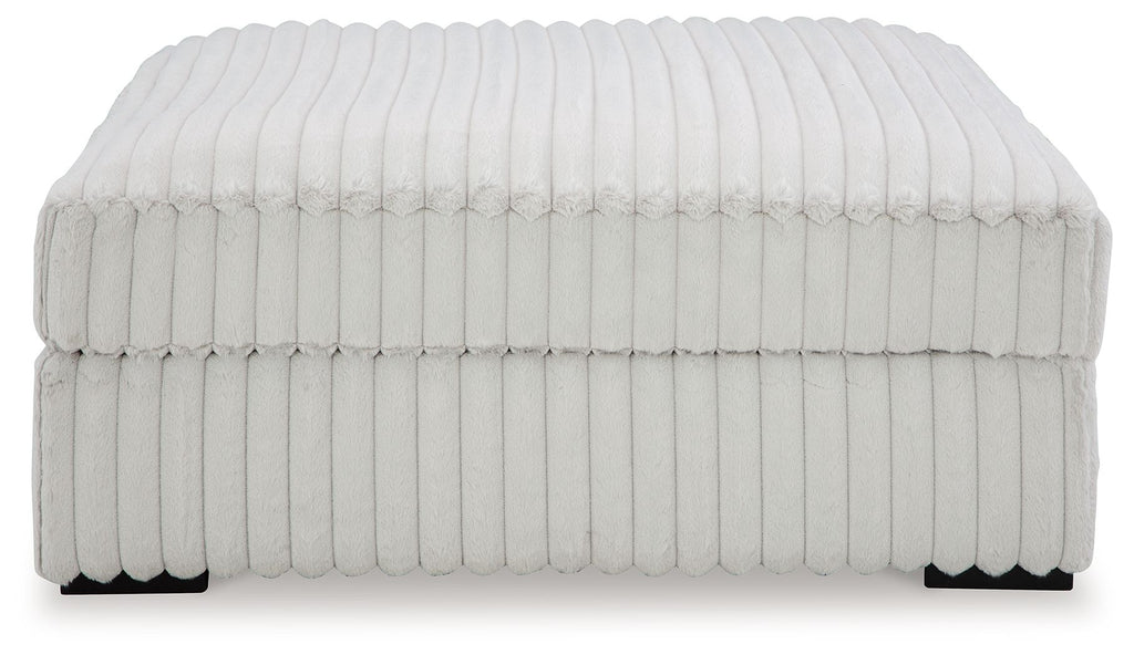 Oversized accent ottoman, light gray ribbed fabric with skirted side panels