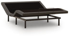 Adjustable bed base with black platform top, raised backrest, and sturdy metal legs