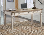 Light brown desk with two drawers and white turned legs, decorative apron
