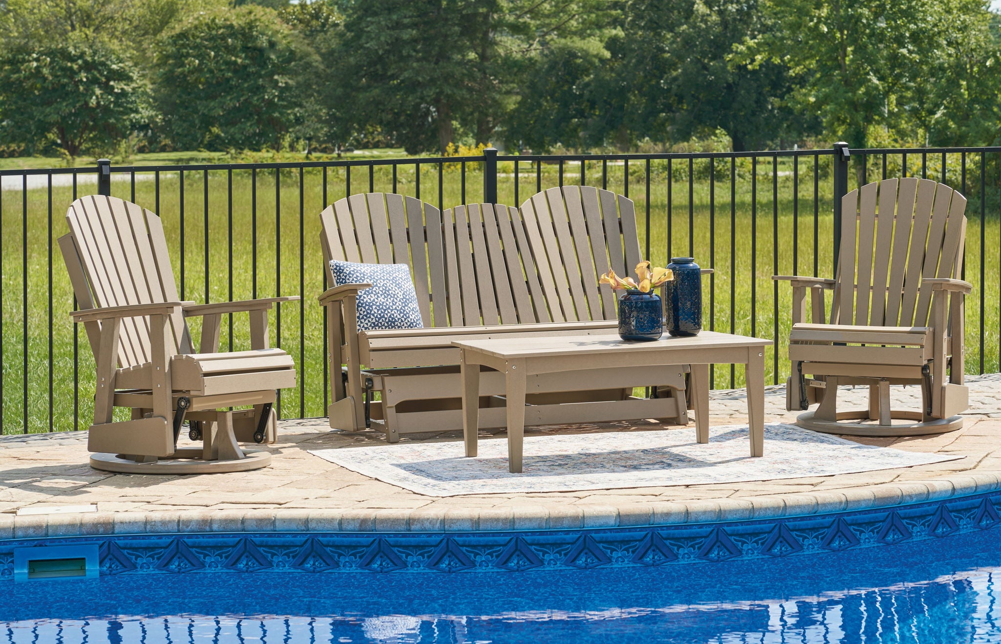 Outdoor set with light gray slat-back loveseat, two chairs, and square coffee table