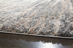 Textured shag rug with mixed gray and beige fibers along the edge