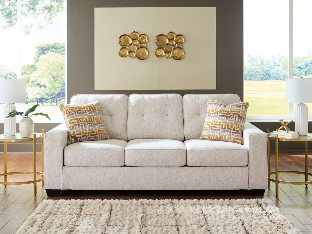 Larimer sofa in beige fabric with three seat cushions and two patterned throw pillows