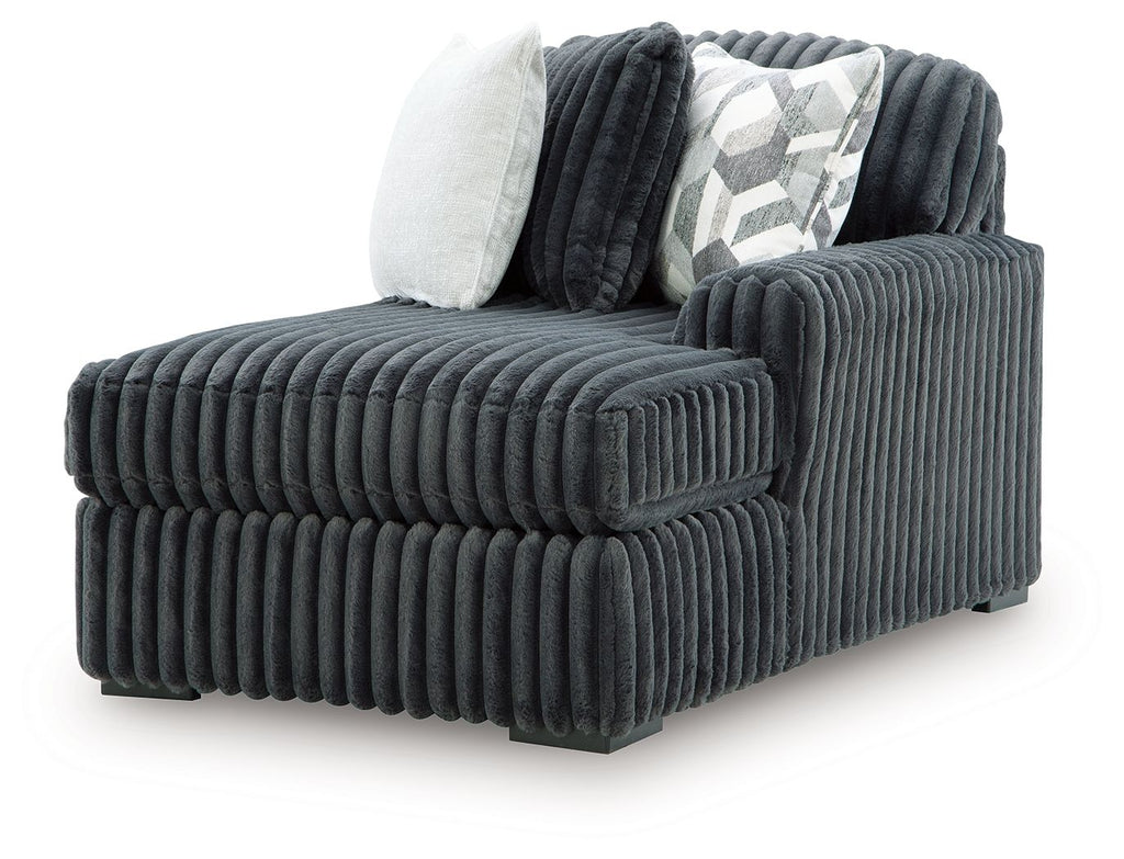 Gunmetal RAF corner chaise with vertical ribbed fabric and back cushions