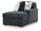 Gunmetal RAF corner chaise with vertical ribbed fabric and back cushions