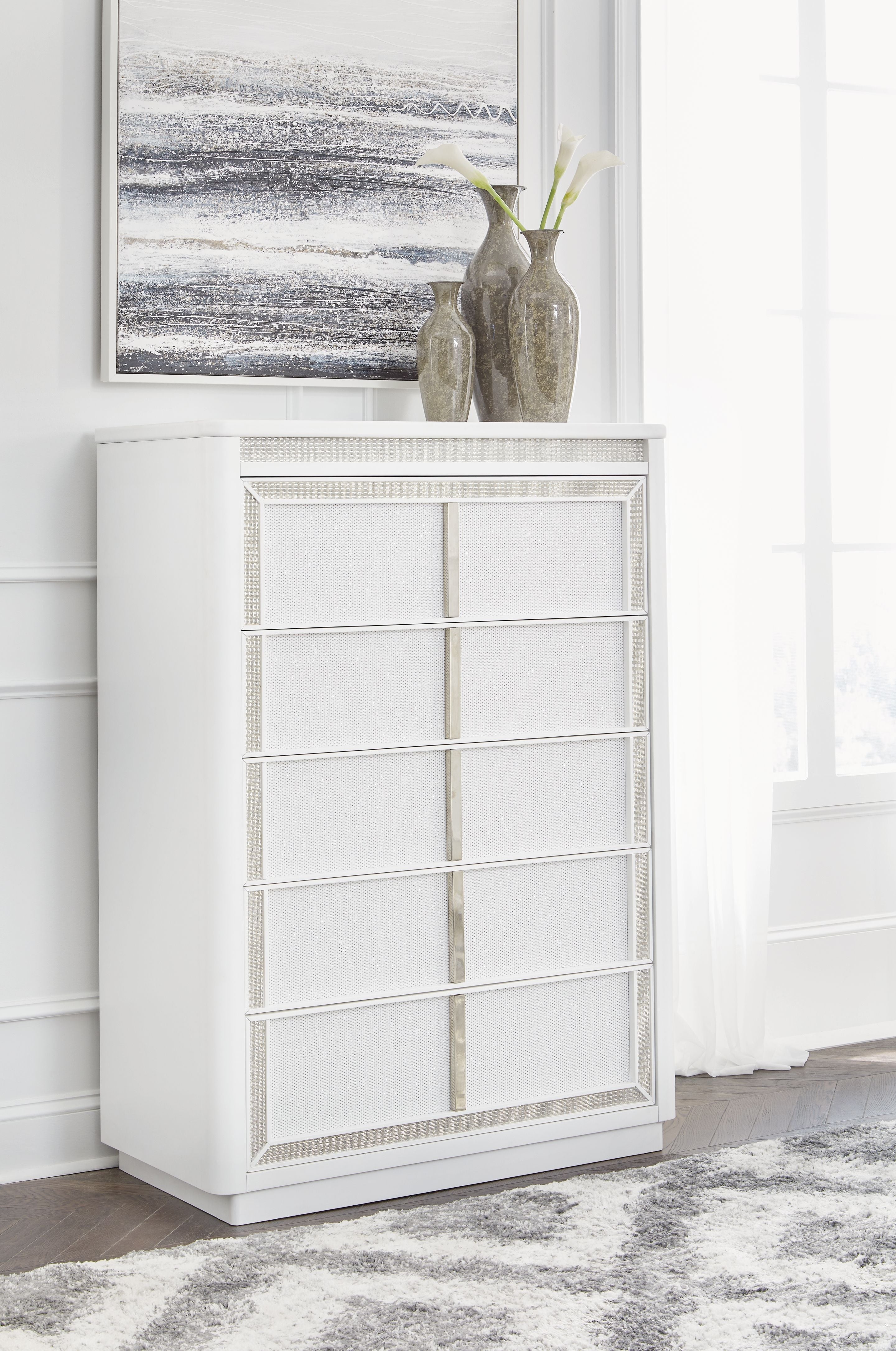 White five-drawer chest with lattice-pattern drawer fronts and wide toe-kick base