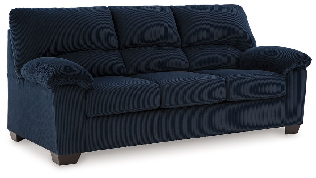 Navy corduroy sofa with tufted back and rolled armrests