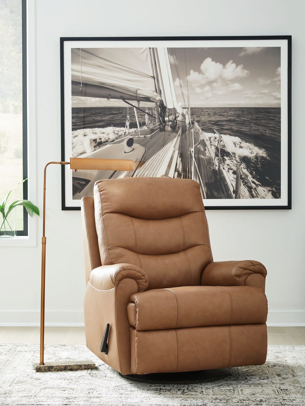 Butternut leather swivel glider recliner in upright position with headrest and arm controls