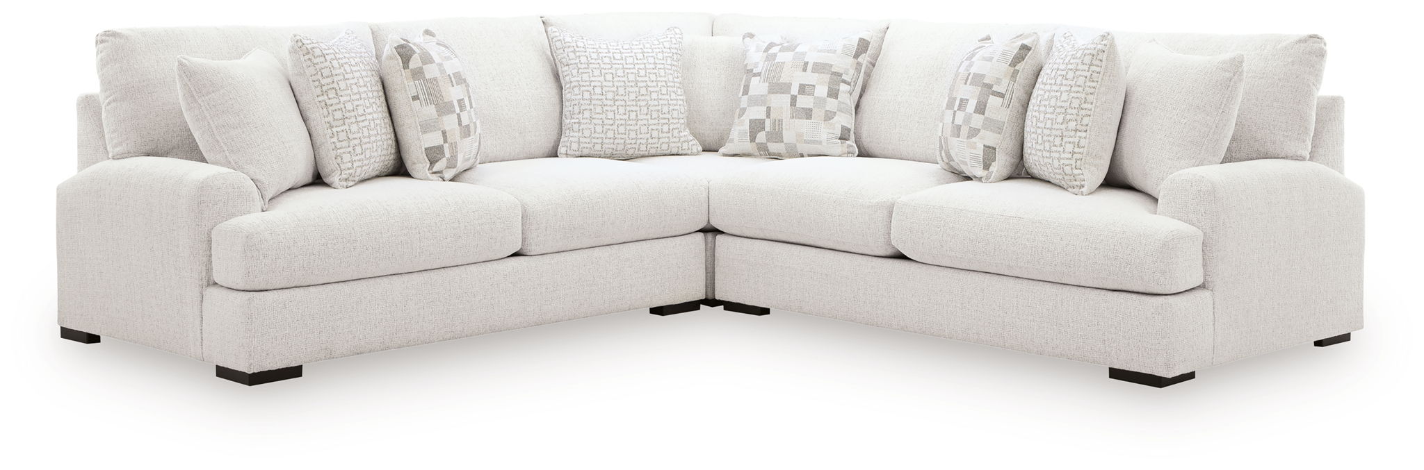 Light beige sectional sofa with two chaise sections and patterned accent pillows