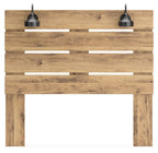 Brown wooden queen panel headboard with horizontal slat openings and two black pendant lights