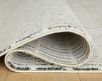Turinwith rug edge, beige border with stitched underside and dark accent lines