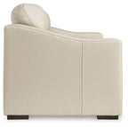 Almond loveseat arm and high backrest with stitching detail and dark feet