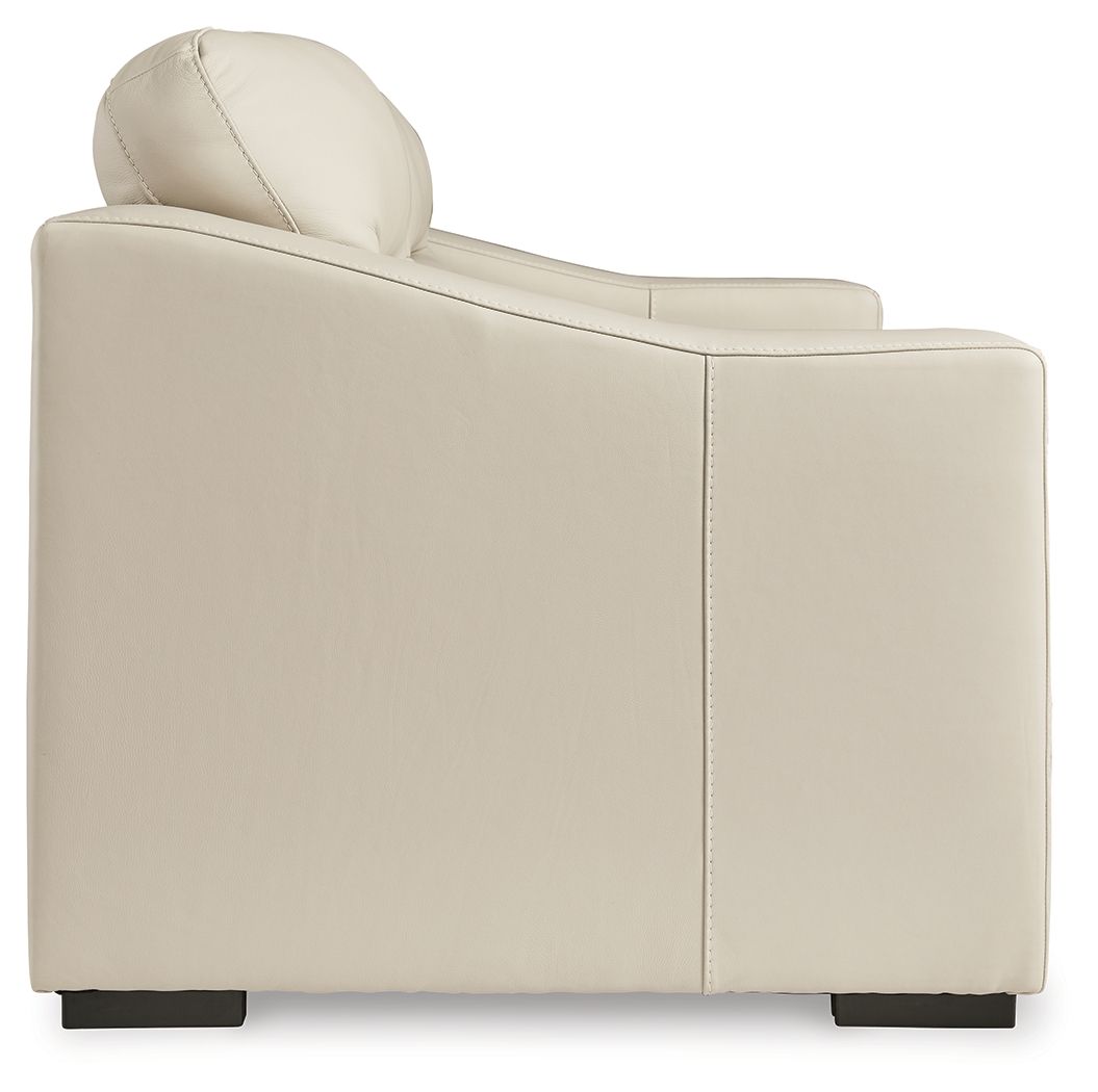 Almond loveseat arm and high backrest with stitching detail and dark feet