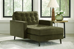 Olive upholstered chaise lounge with tufted back, wide arms, and dark legs