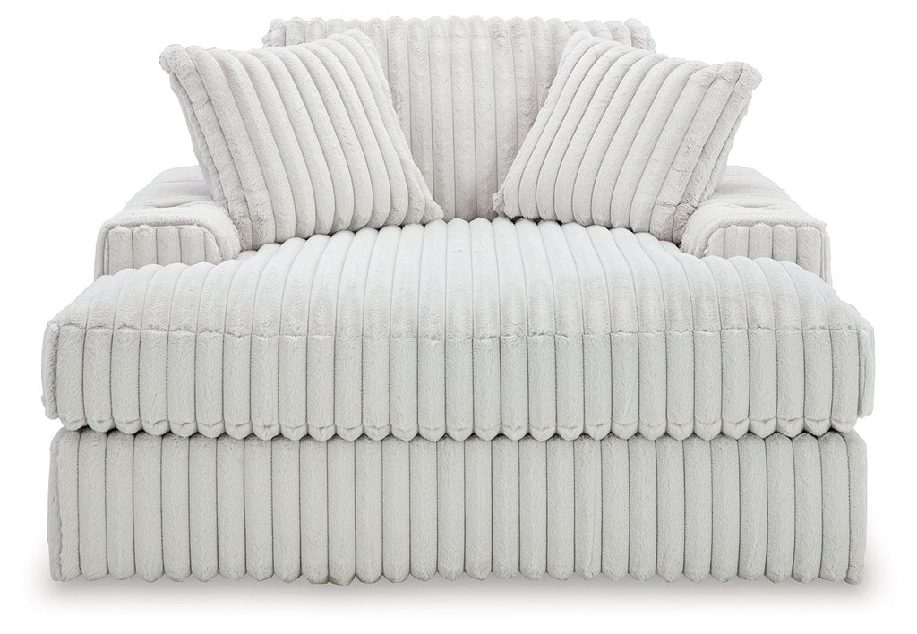 Oversized chaise lounge with ribbed upholstery and two back pillows, light gray