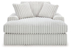 Oversized chaise lounge with ribbed upholstery and two back pillows, light gray
