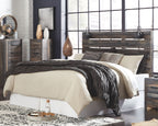 Bedroom set with dark gray panel bed, white and charcoal bedding, and matching nightstands