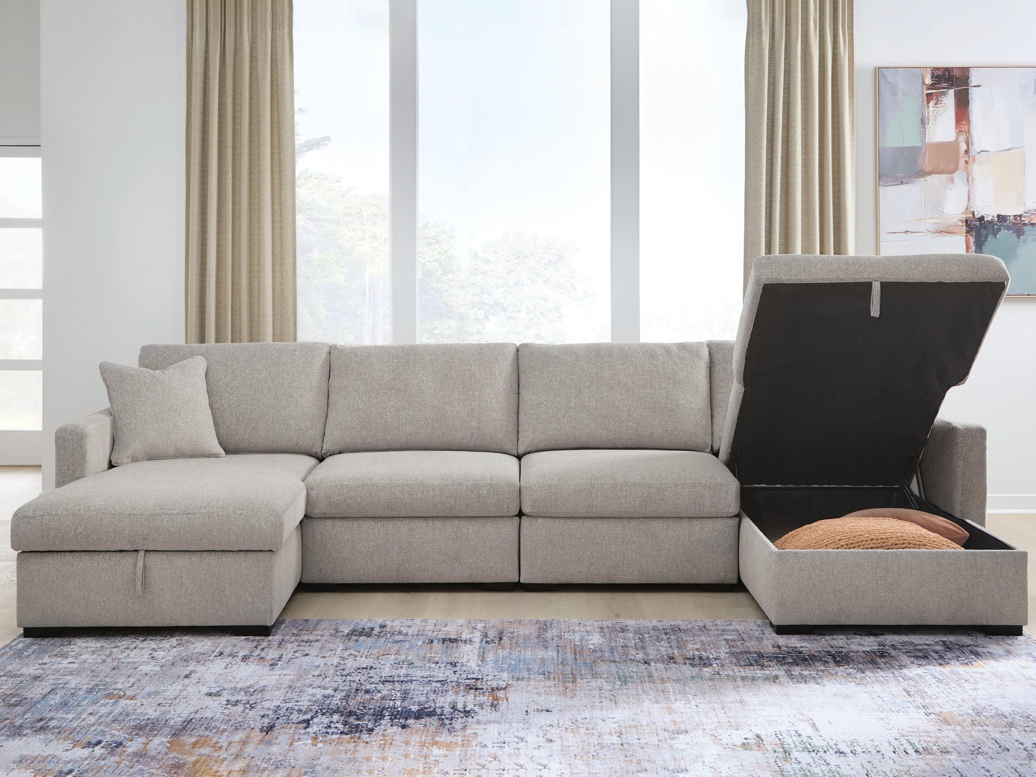 Gray sectional sofa with chaise arm and open storage compartment in the chaise base