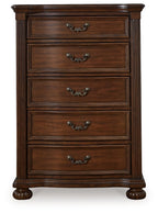 Brown five-drawer wooden chest with arched metal handles and turned feet