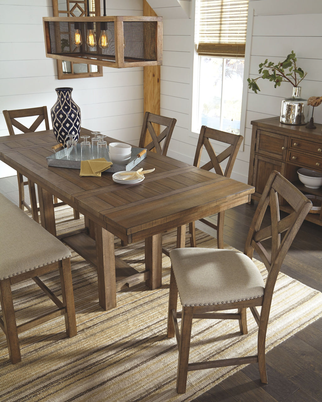 Counter-height dining table with upholstered chairs, bar stools, and dark wood server