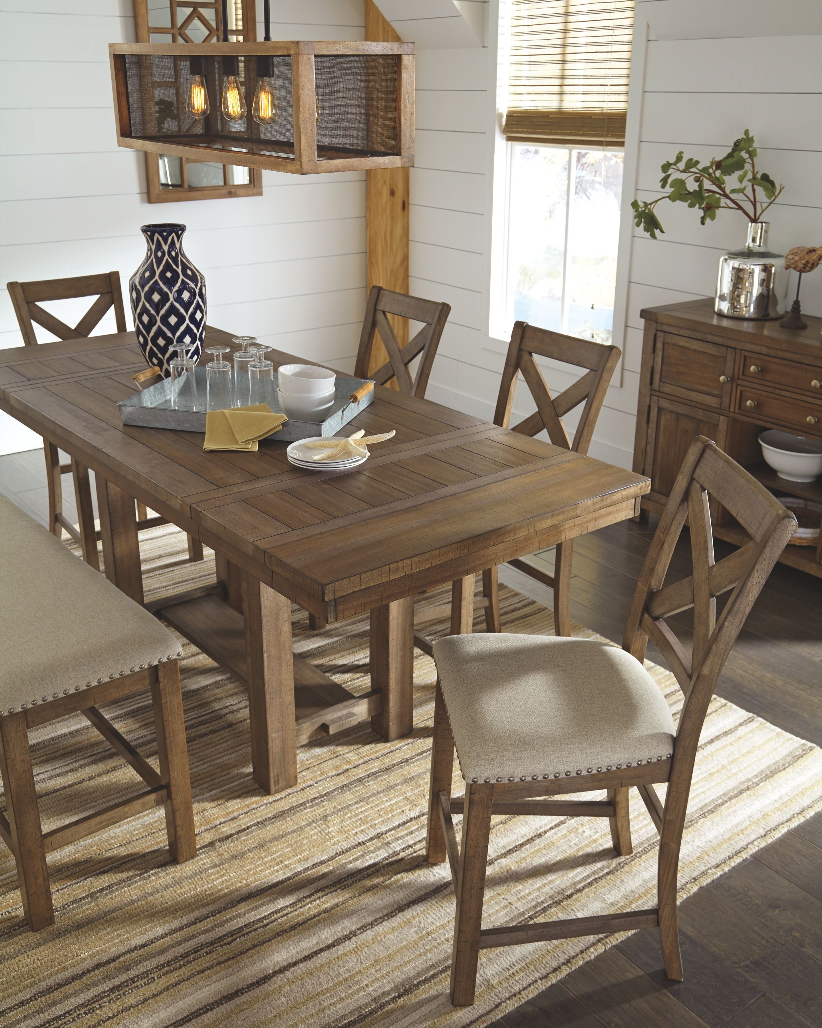 Counter-height dining table with upholstered chairs, bar stools, and dark wood server