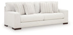 Hartside sofa with off-white fabric, striped throw pillows, two-seat design