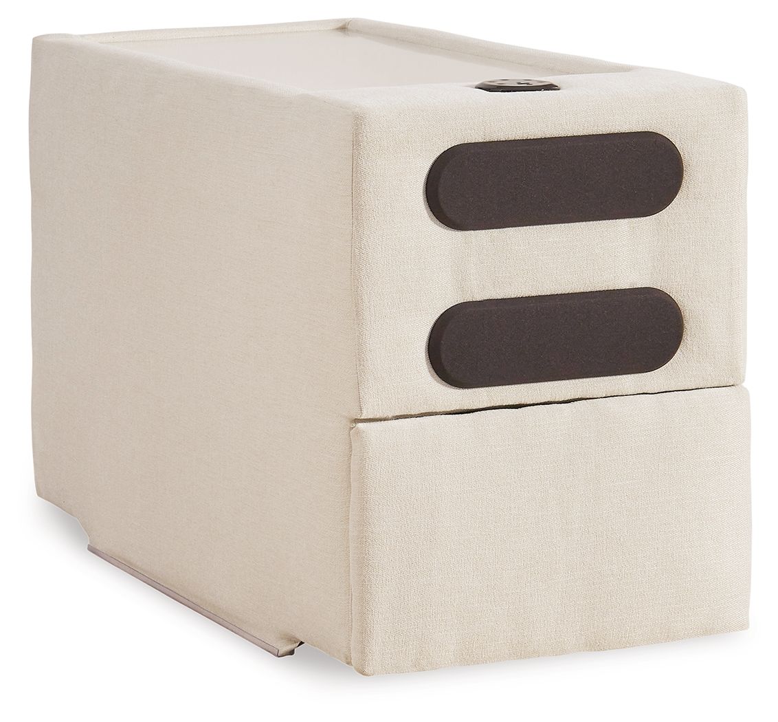 Oyster upholstered console with audio system; two dark oval speaker openings