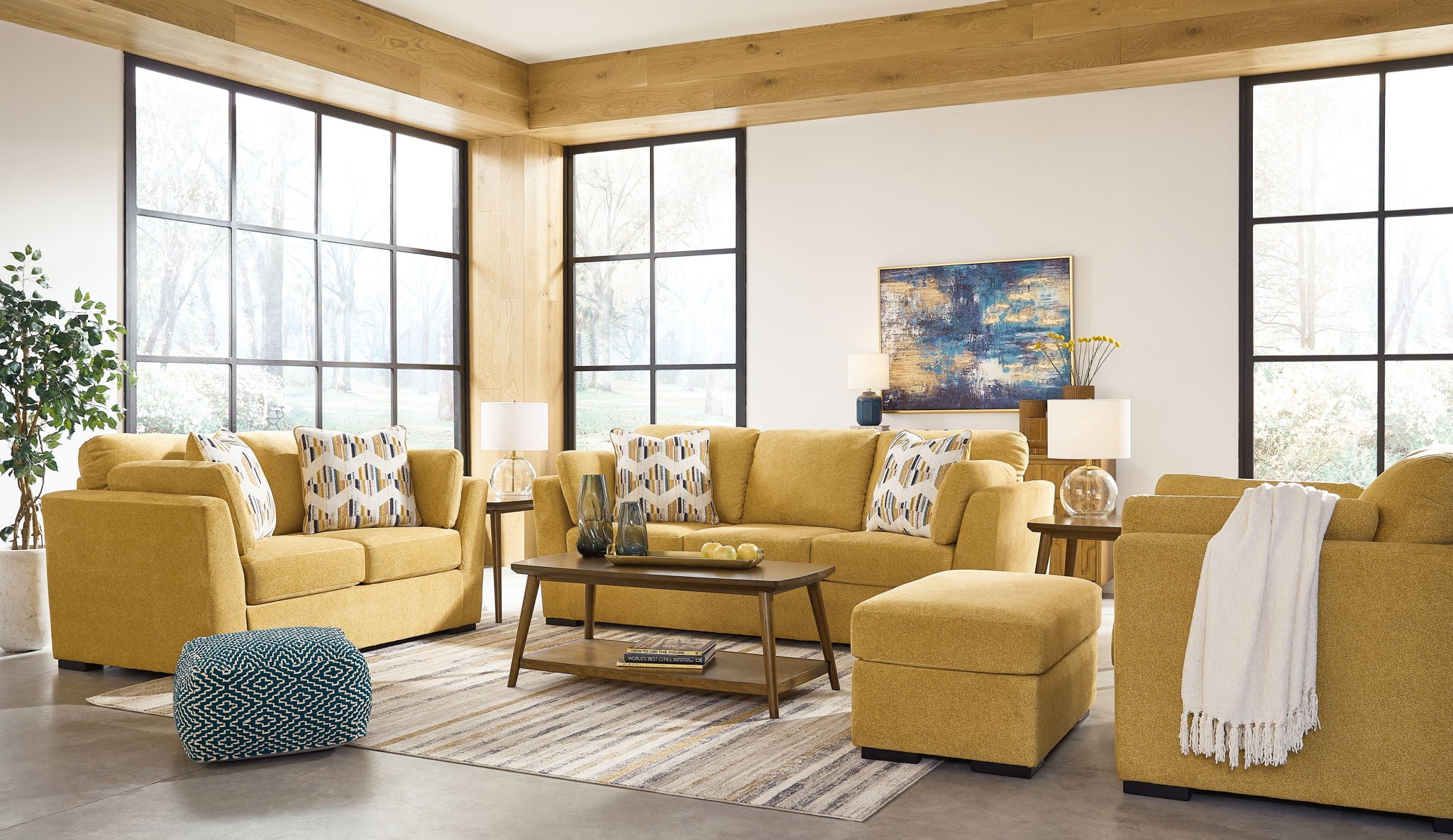 Yellow living room set with sofa, accent chairs, and ottoman