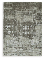 Dark gray area rug with distressed, mottled pattern and short, dense pile texture