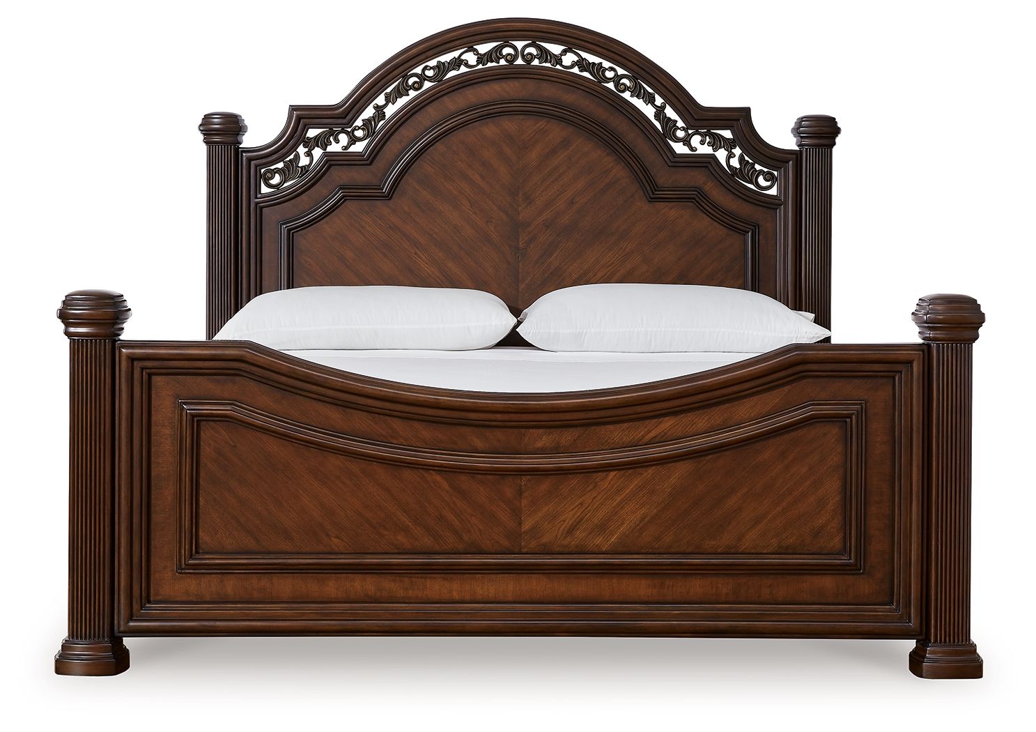 Dark brown poster bed front view with ornate arched headboard, paneled rails, 2 pillows