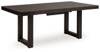 Rectangular dining room extension table, dark gray-brown wood-look top and trestle legs.
