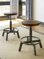 Dark brown round swivel stools beside counter table
