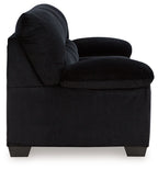Corduroy sofa in dark navy with rolled arms and tufted back cushions