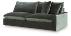 Jade green velvet sofa with curved chaise seat and three tall back cushions