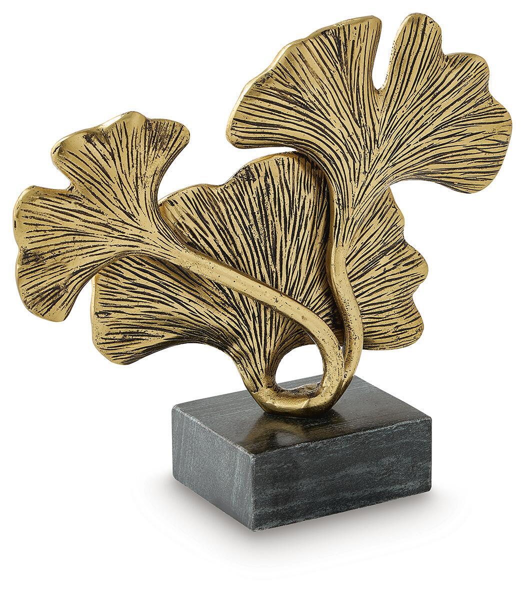 Gold-finish abstract ginkgo leaf sculpture with dark gray base and looped center