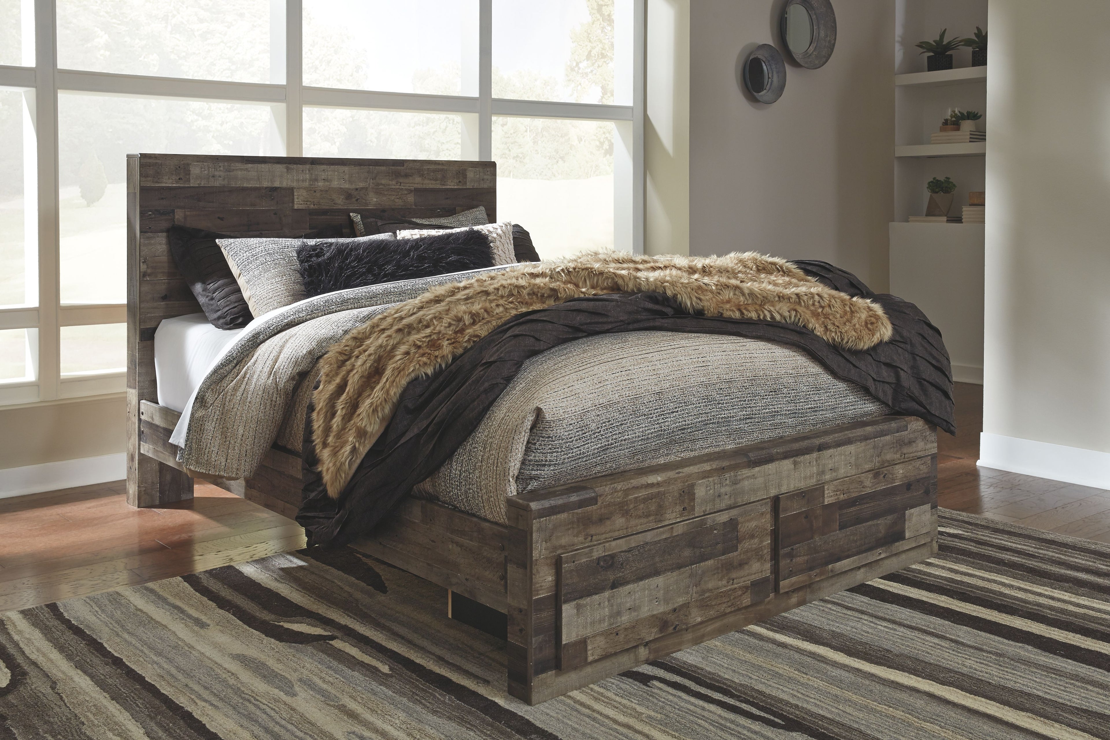 Dark wood panel bed frame with tan faux-fur throw and dark bedding accents