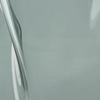 Light blue glass vase close-up of curved side wall and surface