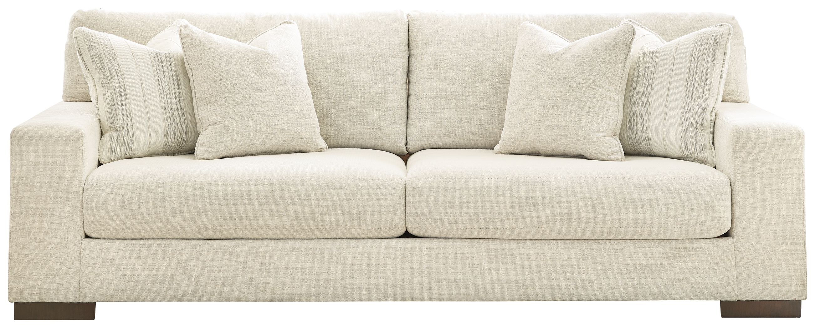 Light beige sofa with padded seat cushions and multiple back pillows