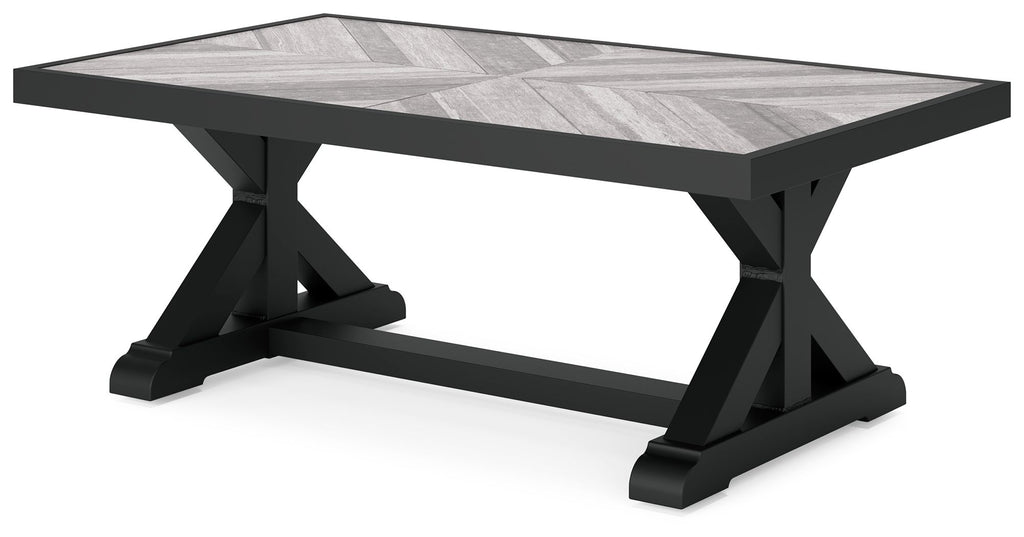 Rectangular cocktail table with black X-style base and light gray tabletop
