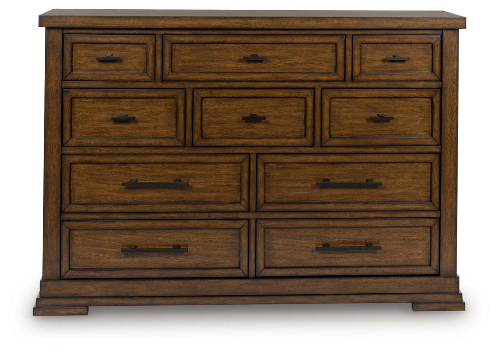 Medium brown wooden dresser with 9 drawers and black pulls, front