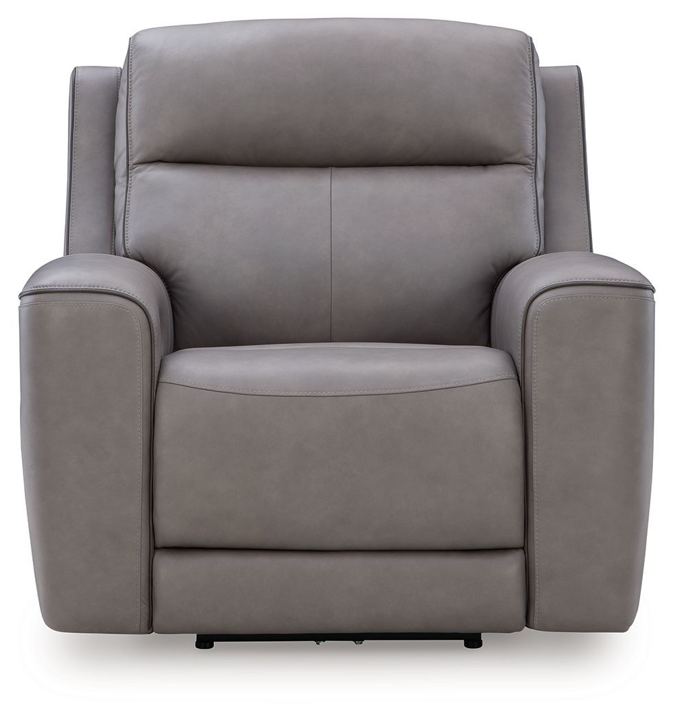 Gray power recliner with adjustable headrest, padded arms, and cushioned seat.