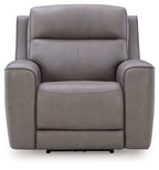 Gray power recliner with adjustable headrest, padded arms, and cushioned seat.