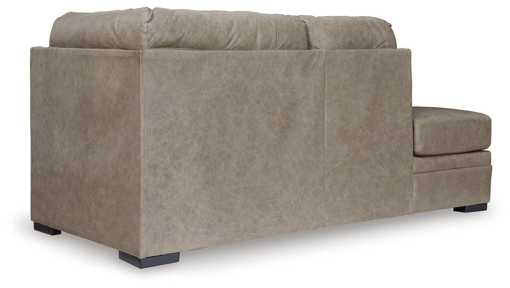 Beige corner chaise sofa shown from side, padded arms, three-seat base, dark legs.