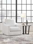 Light gray accent chair with tall back and rounded armrests