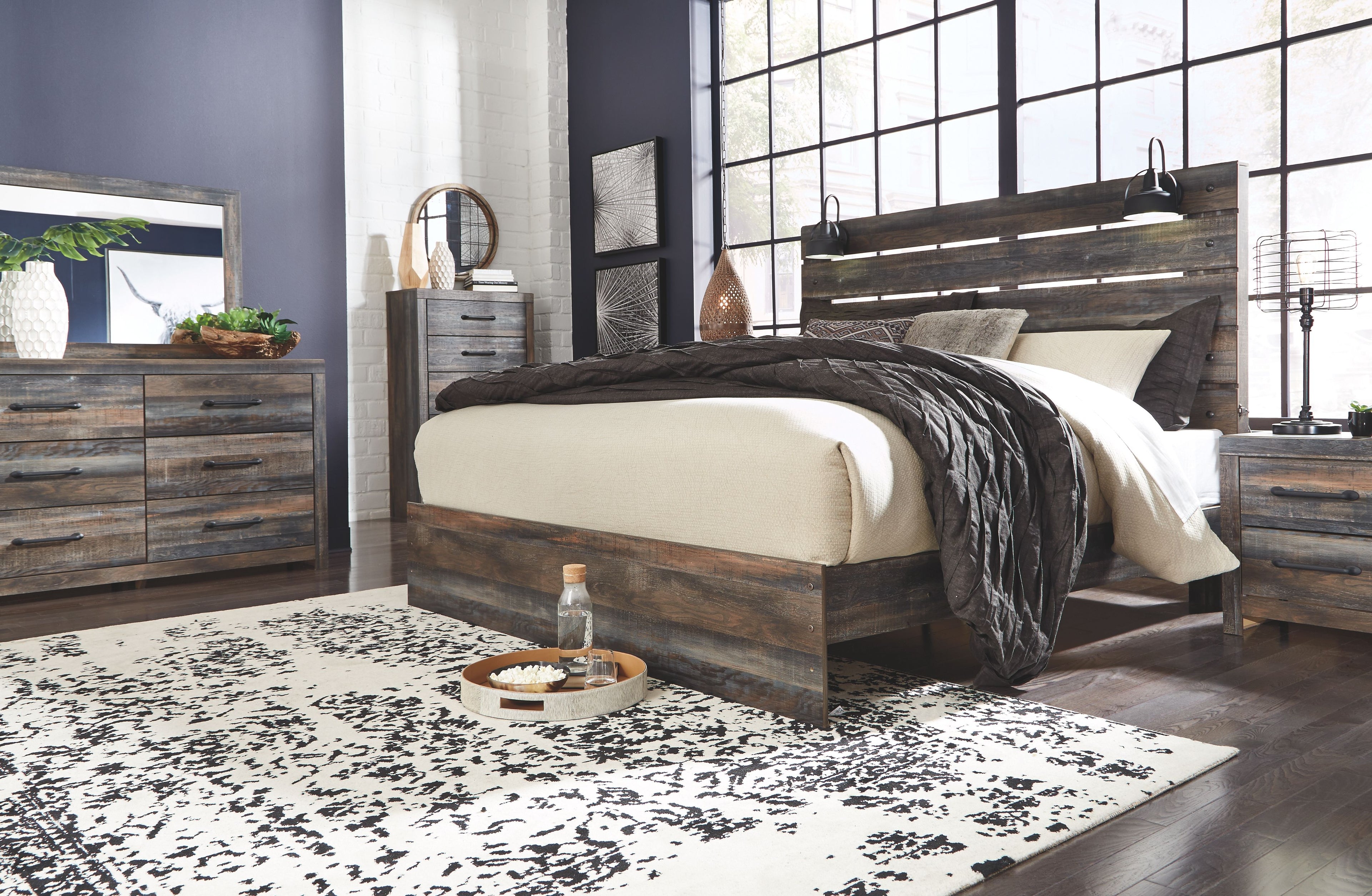 Panel bedroom set with dark wood bed frame, beige headboard, and two decorative pillows