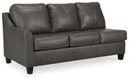Fog gray leather sofa with three seat cushions, square arms, and tapered legs