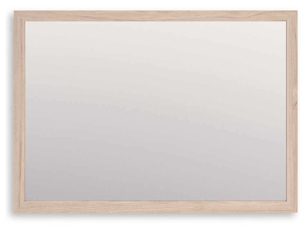 Tan wood-framed rectangular bedroom mirror with clear glass panel